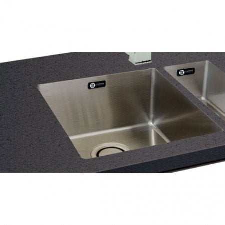 CARRON PHOENIX DECA 105 stainless steel single bowl kitchen sink installed in dark countertop