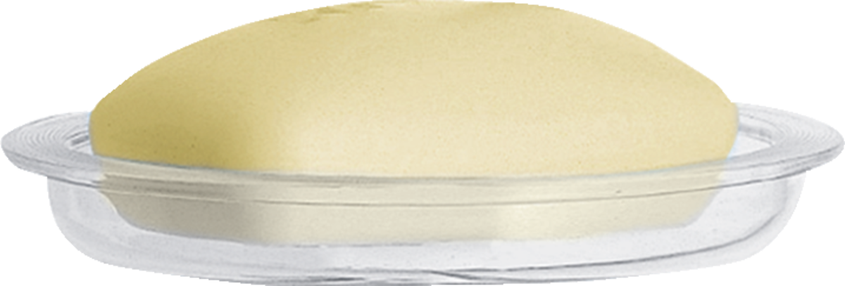 Hansgrohe Casetta's transparent soap dish with integrated drainage holes holding a beige soap bar.