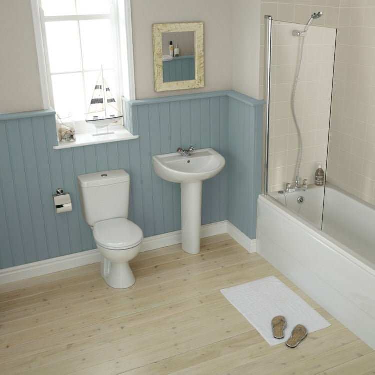 Armitage Shanks Sandringham 21 close coupled white toilet pan in modern bathroom with sink and bathtub
