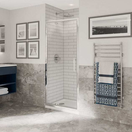 Modern bathroom with Coram 6mm plain glass chrome pivot shower door and tiled walls