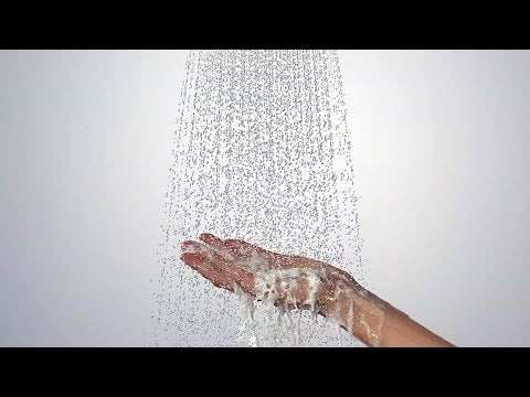 Hansgrohe Crometta S Showerpipe delivering water over hand with chrome finish and large showerhead spray
