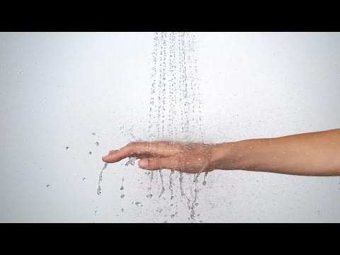 Hand under water stream from Hansgrohe Croma Select S shower with white and chrome finish and 1600mm hose