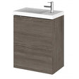 Wall hung vanity unit with compact basin in brown grey Avola finish and single-door storage cabinet