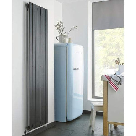 Kartell K-Rad Boston anthracite vertical designer radiator installed in modern kitchen interior