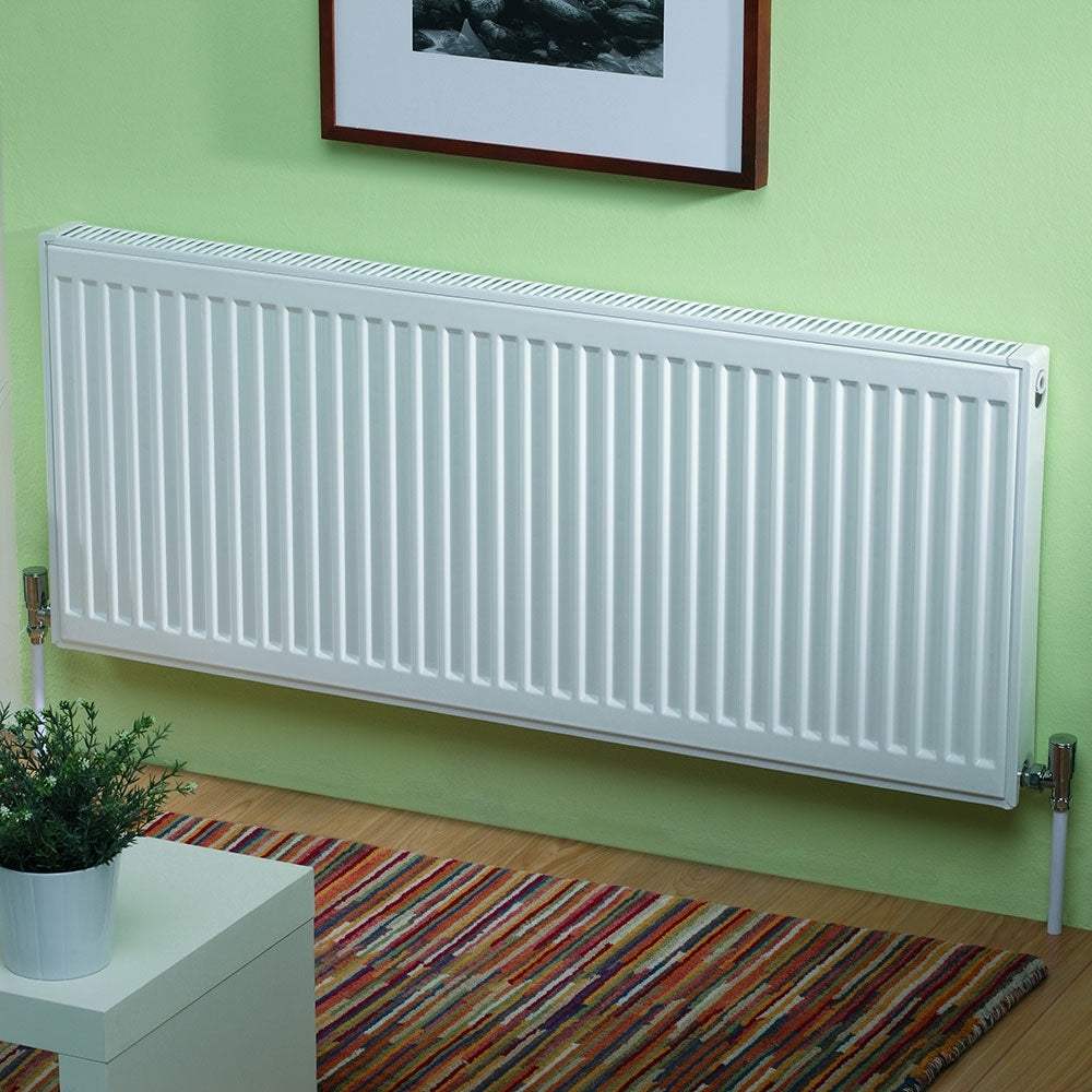 Kartell K-Rad Max Rad 900mm H x 900mm W white double convector compact radiator mounted on green wall in modern room