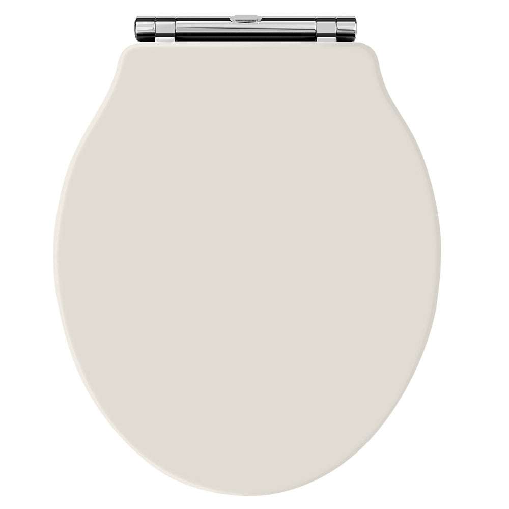 Hudson Reed Chancery traditional soft close toilet seat with polished chrome hinges in timeless sand color