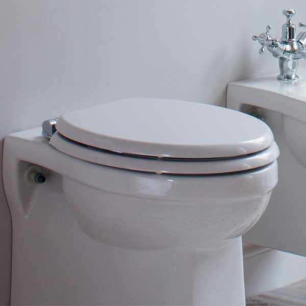 Burlington Standard White carbamide toilet seat with standard hinges on a white toilet in modern bathroom