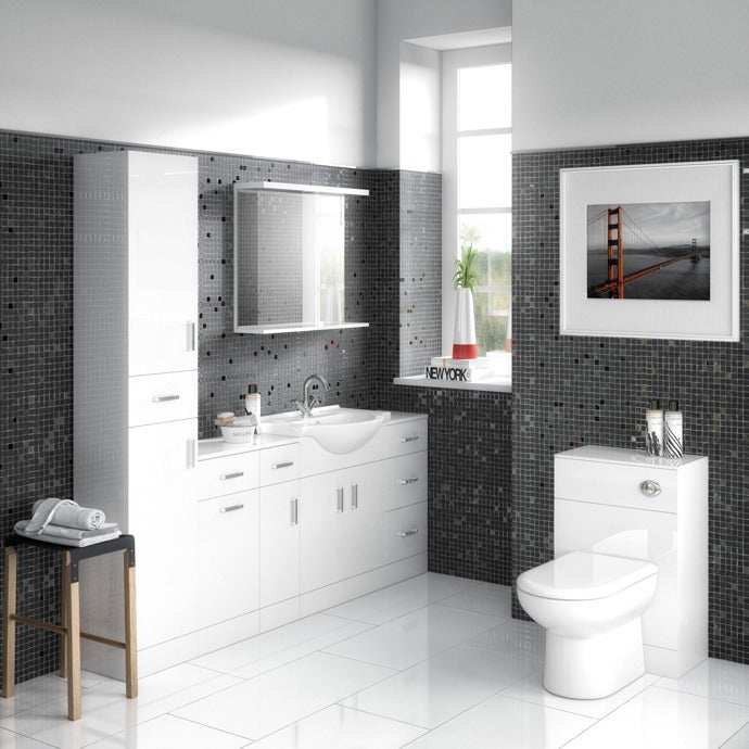 Modern bathroom interior featuring Nuie Freya White contemporary pan, cistern, and seat with sleek white cabinetry and mosaic tile walls