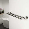 Coram Boston Chrome double towel bar installed in modern bathroom with white wall and bathtub