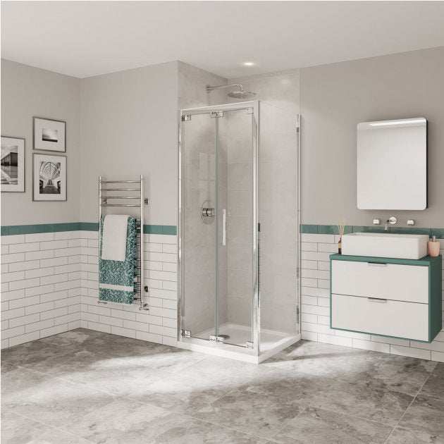 Modern bathroom featuring Coram 6mm Plain Glass Optima 6 Chrome 800mm Bi-Fold Shower Door with polished chrome frame and clear glass