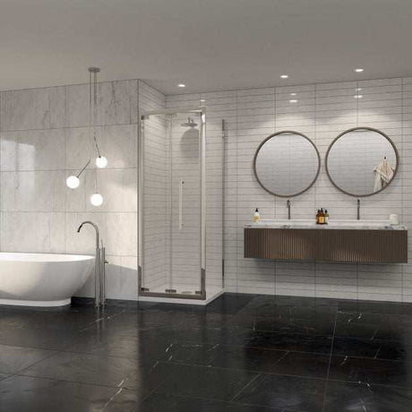 Modern bathroom with Coram 8mm Plain Glass chrome framed bi-fold shower door, freestanding bathtub, and double round mirrors above wall-mounted vanity