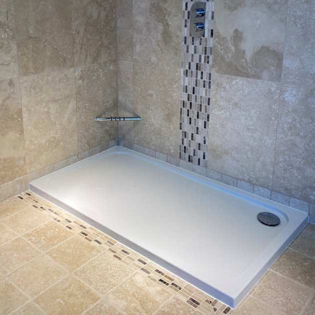 White Coram Resin 1000mm x 800mm rectangular flat top shower tray installed in tiled bathroom