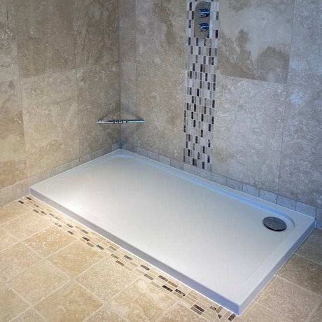 Coram Resin 1200mm x 900mm white rectangular flat top shower tray installed in tiled shower enclosure