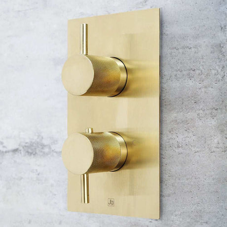 JTP Vos Twin Outlet thermostatic concealed brushed brass shower valve with designer handles on wall