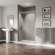 Coram 5mm plain glass chrome framed bi-fold clear shower door in modern bathroom