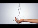 Hand catching flowing water stream from Hansgrohe Raindance E Showerpipe with chrome finish and thermostatic mixer