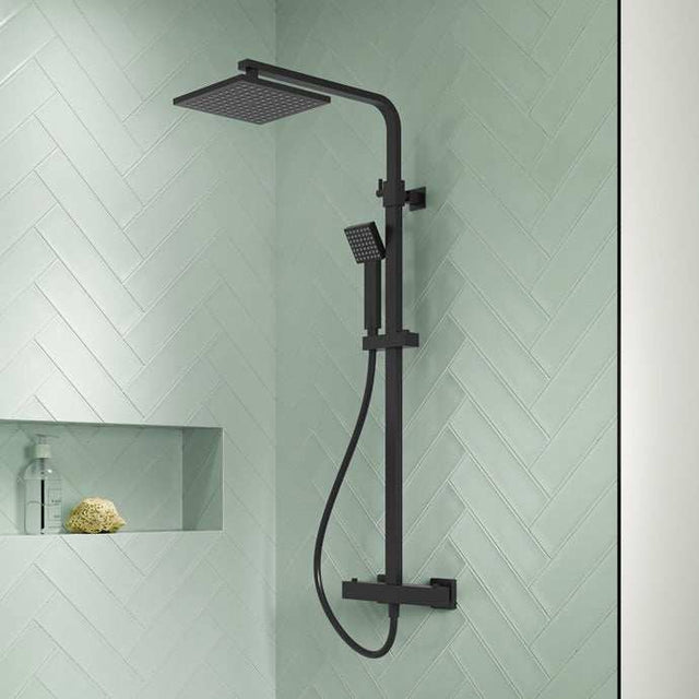 Nuie Square Mixer Shower thermostatic bar with matt black finish, fixed square shower head, and handheld shower kit in a modern bathroom setting