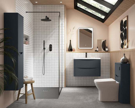 Modern bathroom interior featuring Nuie Arvan Diverter Dual Handle Thermostatic Concealed Shower Valve in matt black with glass shower enclosure and navy blue cabinets.