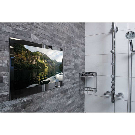 ProofVision 43 inch premium waterproof bathroom TV with mirror finish mounted on grey tiled wall next to showerhead and chrome shower shelf