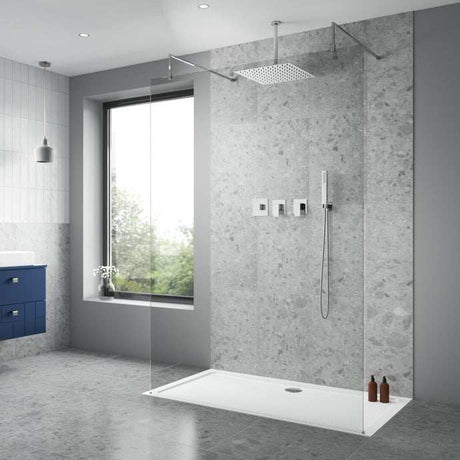 Modern bathroom with Nuie Thermostatic Concealed Windon Mixer Shower featuring fixed overhead showerhead, handheld shower, and sleek concealed controls on gray stone wall