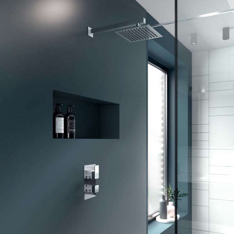 Nuie Windon thermostatic diverter dual handle concealed chrome shower valve installed in modern bathroom